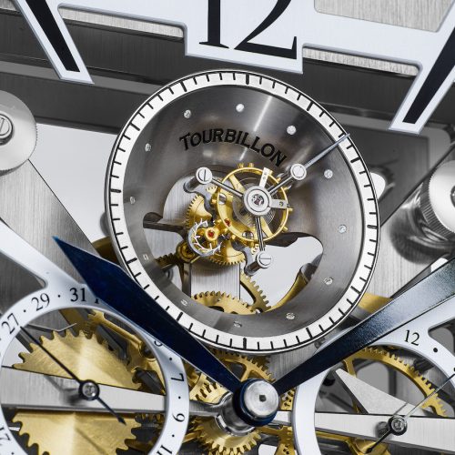 Das fliegendes Minutentourbillon sitzt in einem Trichter mit zwölf Brillanten mit kleiner Sekundenanzeige auf dem Trichterrand. Das fliegendes Minutentourbillon sitzt in einem Trichter mit zwölf Brillanten mit kleiner Sekundenanzeige auf dem Trichterrand.