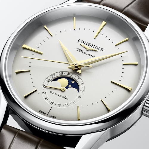 Longines Flagship Heritage Opal Silber L4.815.4.78.2 Detail Das gewölbte Zifferblatt in Opal-Silber besitzt elf applizierte Indizes und vergoldete Zeiger.