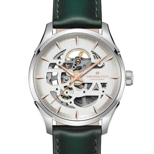 Hamilton Jazzmaster Skeleton H42535810 weißes Blatt grünes Lederband Beim weißen Zifferblatt stattet Hamilton die Jazzmater Skeleton mit einem grünen Lederband aus.
