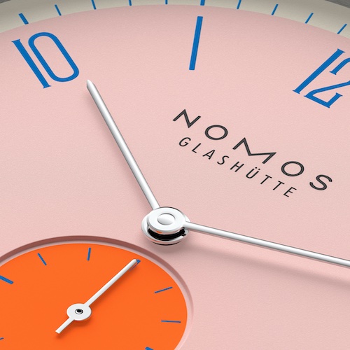 Nomos Glashütte Tangente 38 Datum Flamingopink Dieses echte Rosa ist nach den Farben der langbeinigen Vögel benannt, die nun auch immer öfter an europäischen Ufern stehen. Am liebsten auf einem Bein, denn ihr besonderer Körperbau sorgt dafür, dass das einbeinige Stehen fast keine Kraft kostet.