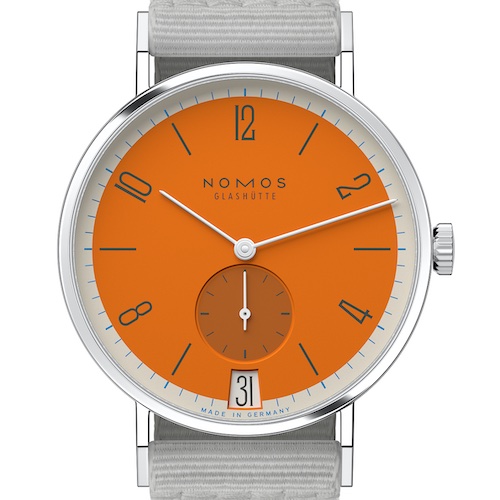 Nomos Glashütte Tangente 38 Datum Boje Ein besonderer Blickfang gelingt der Uhr durch ihre Minuterie in Creme- weiß, durch die kleine Sekunde (deren Apfel- sinenton im Schatten liegt) und die ebenfalls orangefarbene Anzeige des Datums.