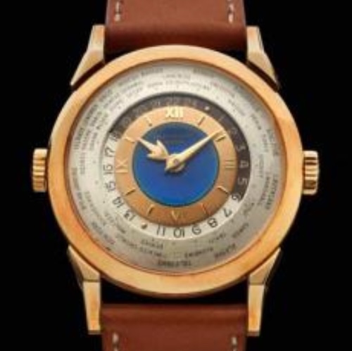 Die Referenz 2523J von Patek Philippe, eine Weltzeituhr mit zwei Kronen von 1953 wurde vom Uhrmacher Louis Cottier geschaffen.