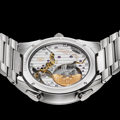 Der Mikrorotor sit mit einem Gerstenkornmuster guillochiert.